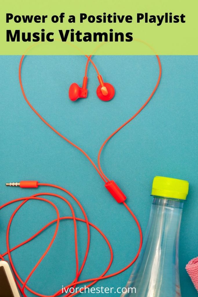 music-vitamins-red-earbuds-water-bottle-cell-phone